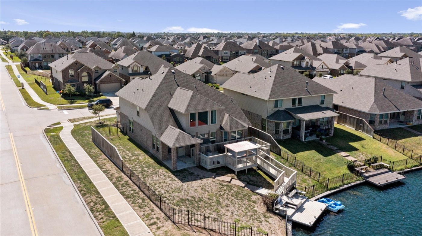 Aerial view of a Greater Houston suburban home and architectural shingle roof
