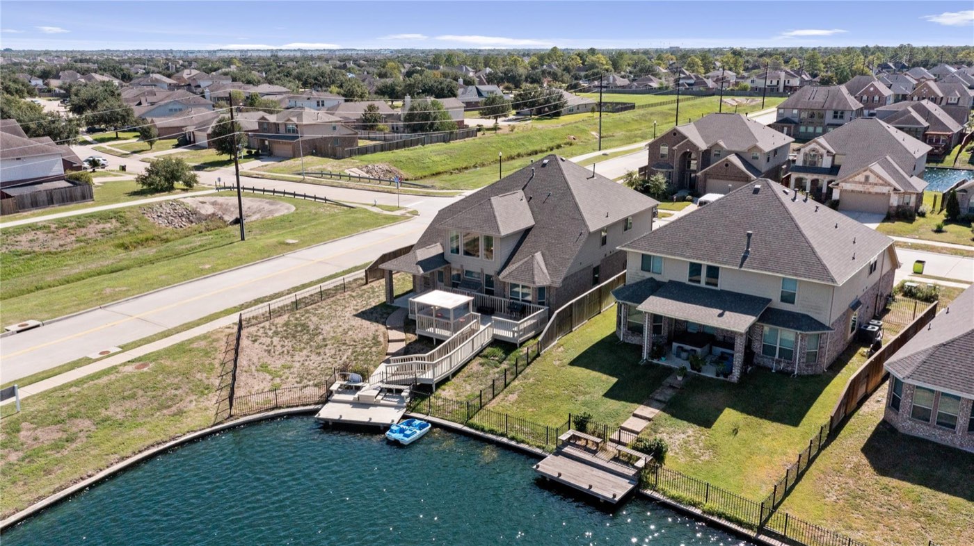 Aerial view of a completed Greater Houston property and surrounding neighborhood